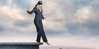 woman stepping off ledge