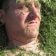 man covered in grass
