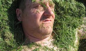 man covered in grass